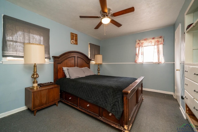 carpeted bedroom with baseboards and a ceiling fan