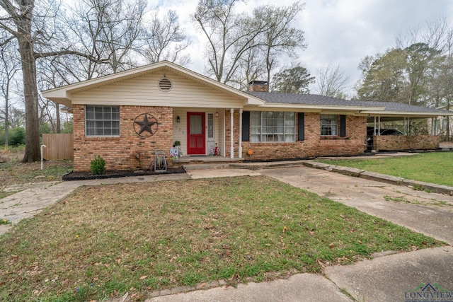 ranch-style house with brick siding, a chimney, a front lawn, and fence