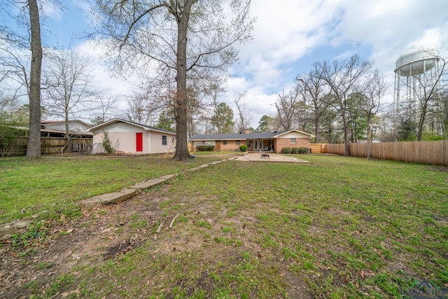 view of yard with a patio and a fenced backyard