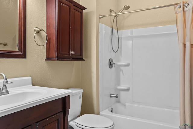 full bathroom with a textured wall, shower / tub combo with curtain, vanity, and toilet