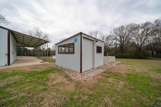 view of outbuilding with a yard