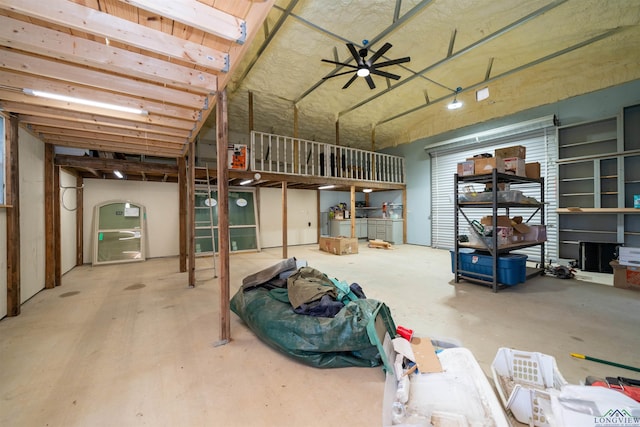 miscellaneous room with concrete flooring and ceiling fan