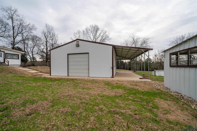 garage with a lawn and a carport