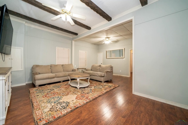 living room with beam ceiling, dark wood-type flooring, and ceiling fan