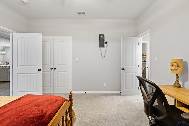 bedroom with a closet and carpet floors