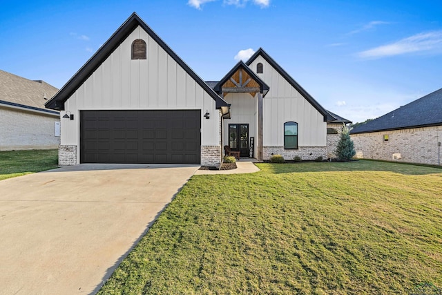 modern inspired farmhouse with a garage and a front yard