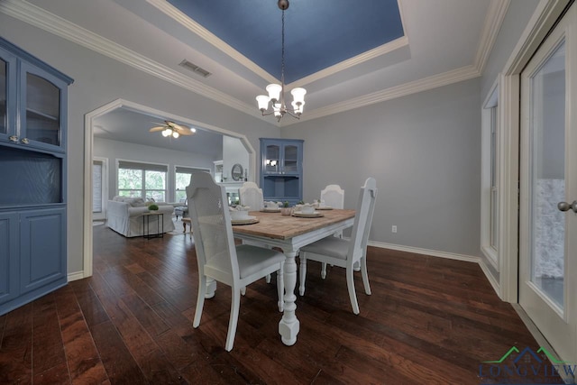 519 Hideaway Ln E, Hideaway, TX 75771 - dining room featuring visible vents, ornamental molding, a tray ceiling, ceiling fan with notable chandelier, and dark wood-type flooring
