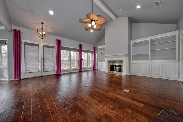 unfurnished living room featuring ceiling fan, beam ceiling, high vaulted ceiling, a fireplace, and dark hardwood / wood-style flooring