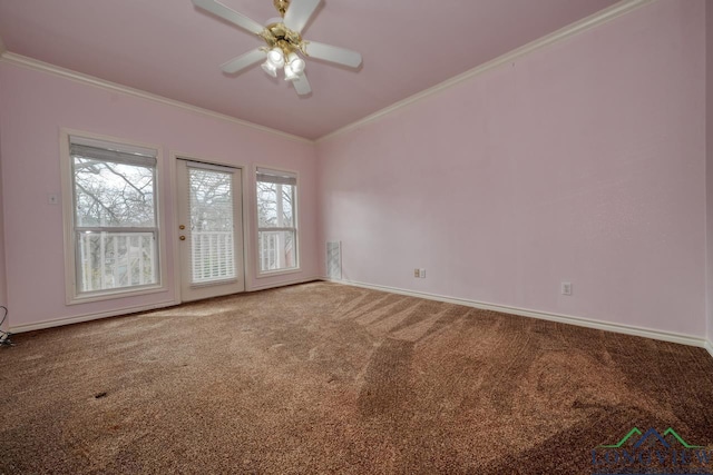 carpeted empty room featuring ornamental molding and ceiling fan