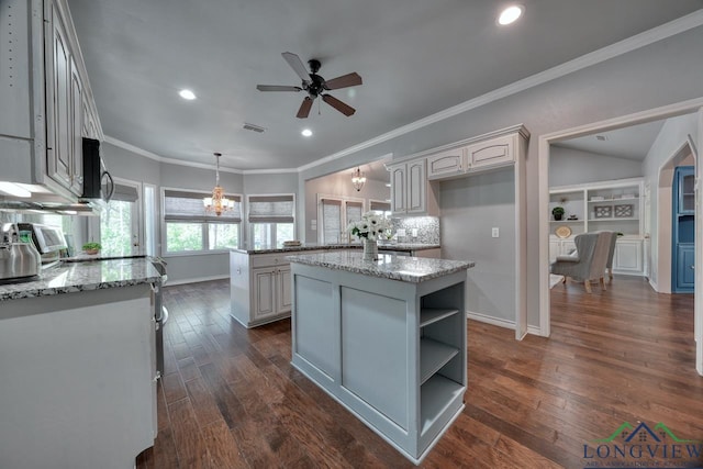 519 Hideaway Ln E, Hideaway, TX 75771 - kitchen with ceiling fan with notable chandelier, dark wood finished floors, visible vents, recessed lighting, and a kitchen island