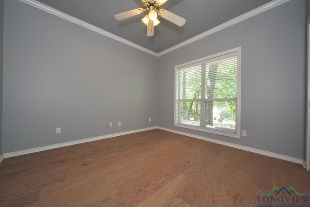 519 Hideaway Ln E, Hideaway, TX 75771 - empty room featuring baseboards, crown molding, and wood finished floors