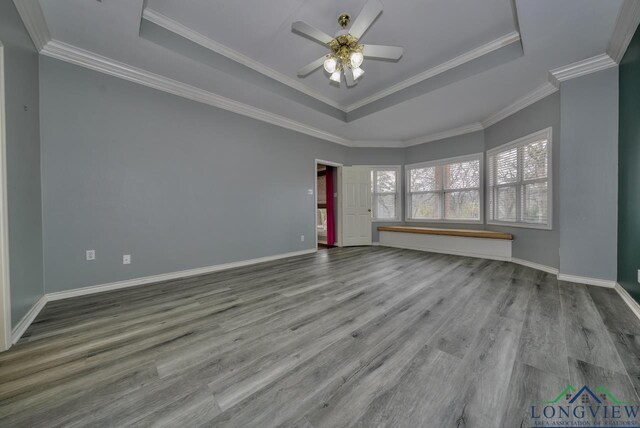 unfurnished room with hardwood / wood-style floors and crown molding