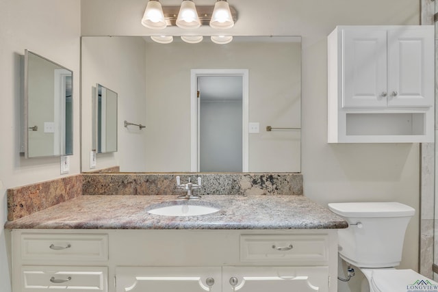 1702 Eastwood St, Longview, TX 75604 - bathroom with vanity and toilet