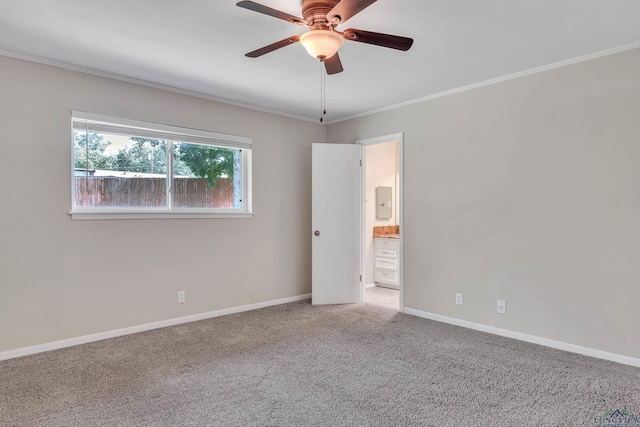 1702 Eastwood St, Longview, TX 75604 - spare room with ceiling fan, ornamental molding, and carpet floors