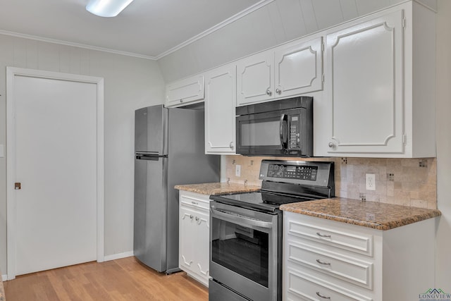 1702 Eastwood St, Longview, TX 75604 - kitchen featuring stainless steel appliances, ornamental molding, backsplash, light wood-style floors, and white cabinets