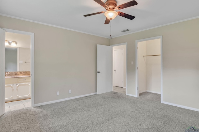 1702 Eastwood St, Longview, TX 75604 - unfurnished bedroom featuring light carpet, ornamental molding, a closet, ensuite bath, and a ceiling fan