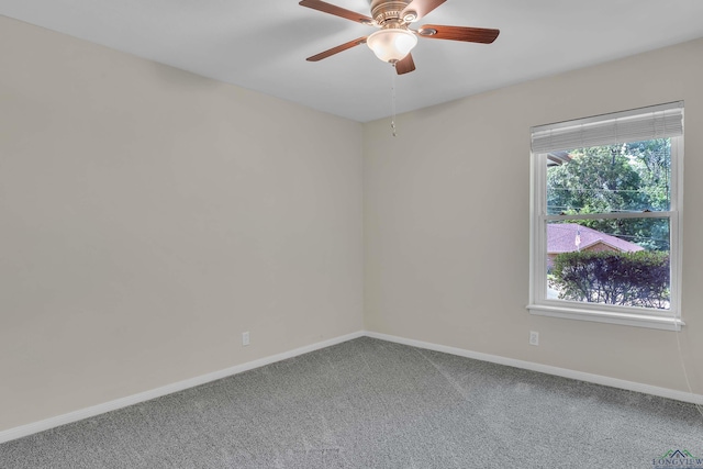 1702 Eastwood St, Longview, TX 75604 - carpeted spare room featuring baseboards and ceiling fan