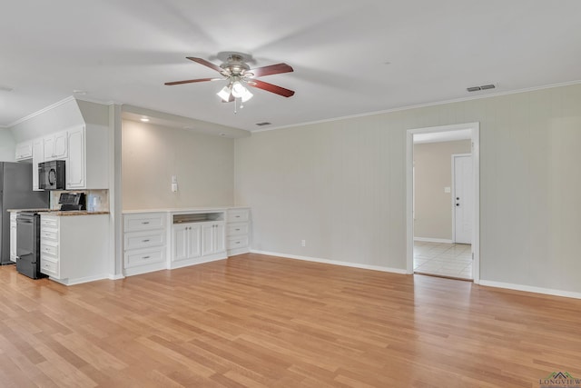 1702 Eastwood St, Longview, TX 75604 - unfurnished living room with ceiling fan, crown molding, and light wood-style flooring