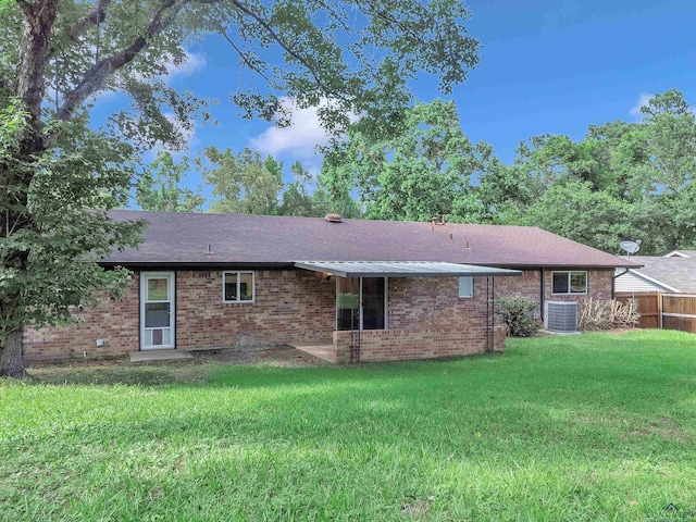 1702 Eastwood St, Longview, TX 75604 - back of property featuring roof with shingles and brick siding