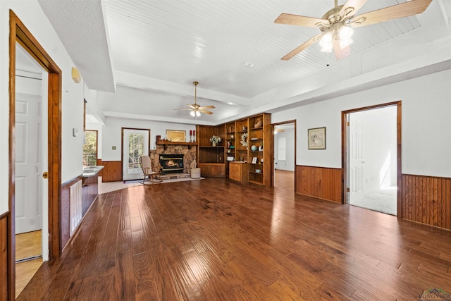 unfurnished living room featuring a fireplace, hardwood / wood-style flooring, and ceiling fan