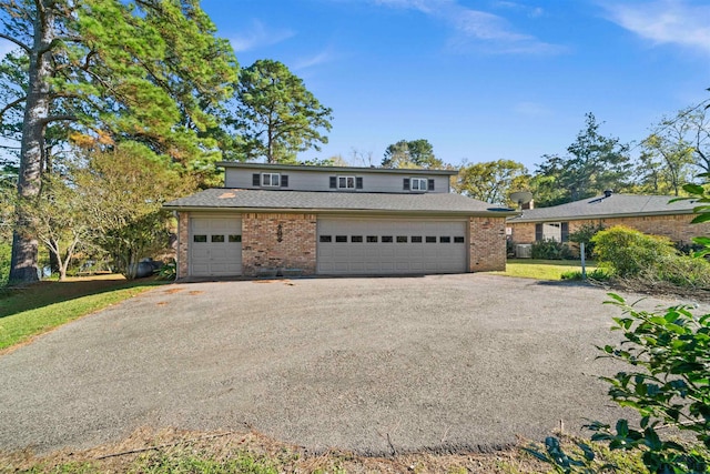 front facade with a garage