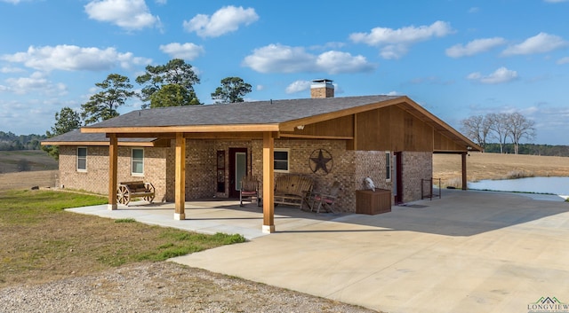 rear view of house featuring a patio area