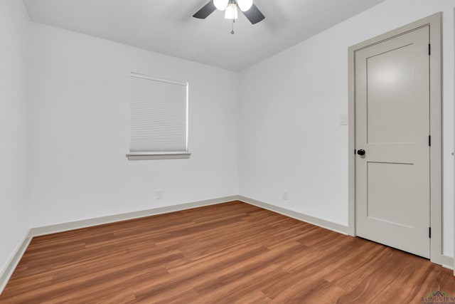 unfurnished room with hardwood / wood-style floors and ceiling fan