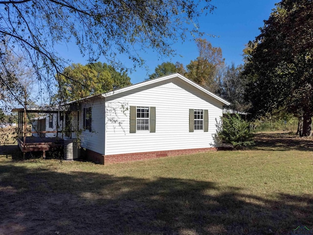 view of property exterior with a yard