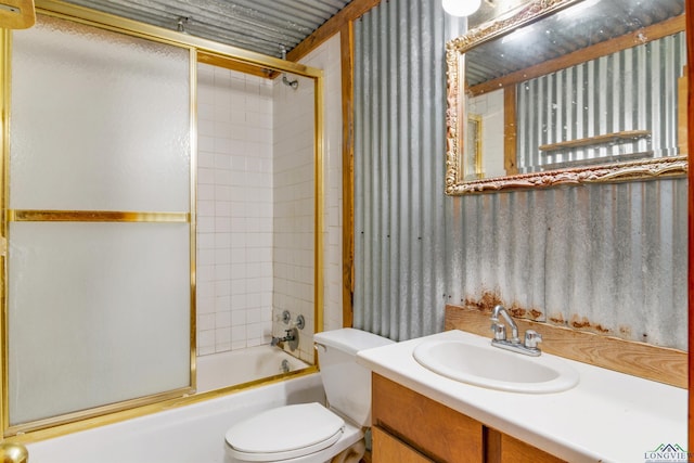 full bathroom with toilet, vanity, and combined bath / shower with glass door