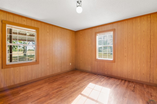 empty room with light hardwood / wood-style flooring