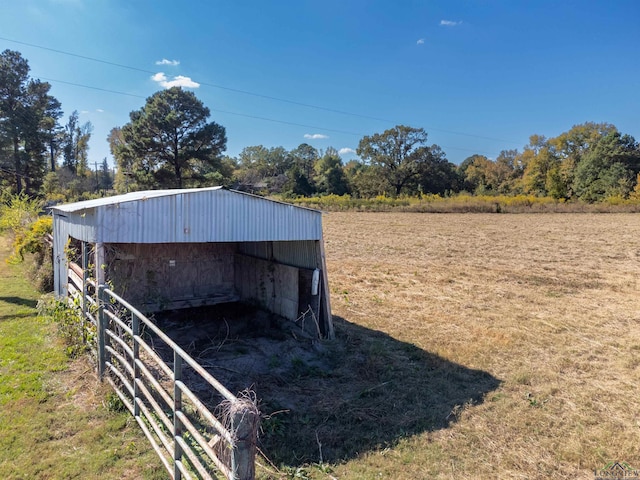 view of outdoor structure with a rural view