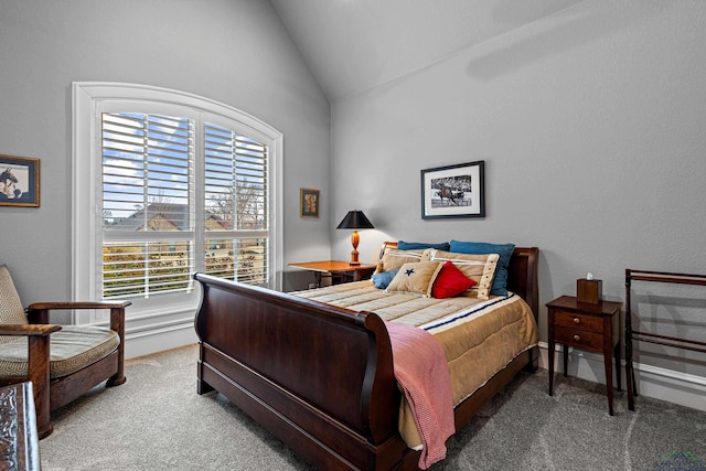 bedroom with vaulted ceiling and carpet flooring