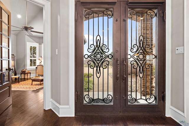interior space featuring ceiling fan, french doors, wood finished floors, and baseboards