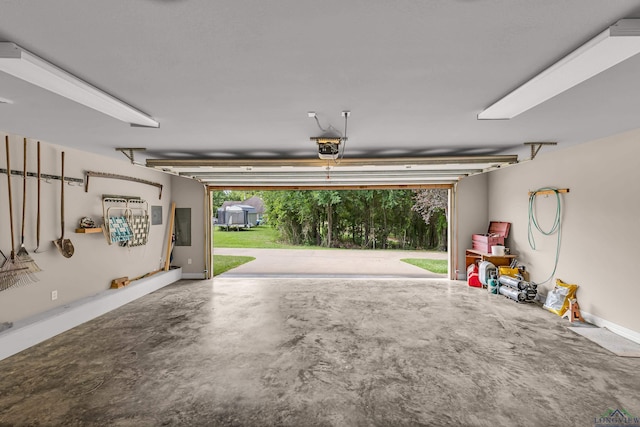 garage featuring a garage door opener and electric panel