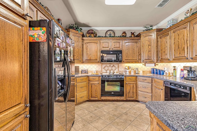 kitchen featuring black appliances, decorative backsplash, light tile patterned flooring, and crown molding