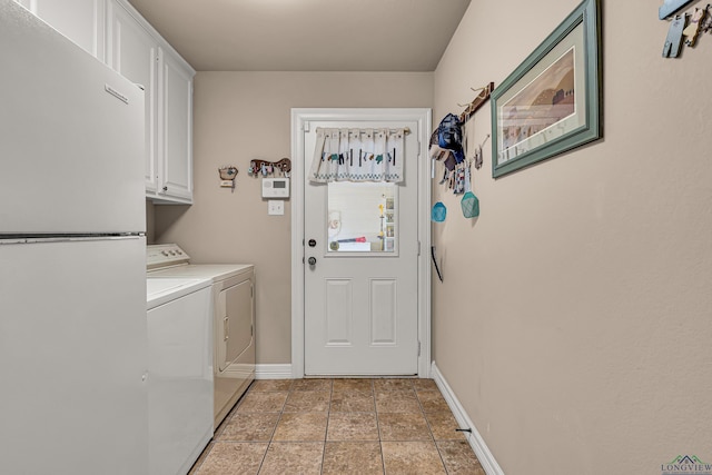 washroom with cabinets and independent washer and dryer