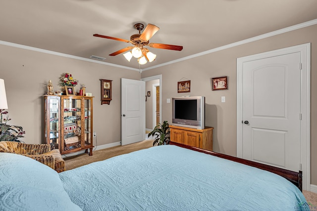 carpeted bedroom with ceiling fan and ornamental molding