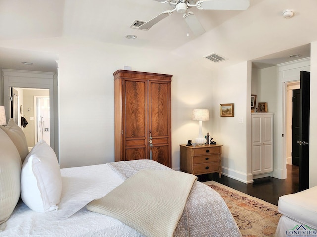 bedroom with ceiling fan, lofted ceiling, and dark hardwood / wood-style floors