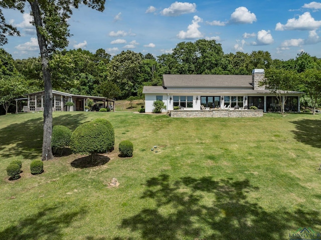 435 Acr 3763, Palestine, TX 75801 - view of front of home featuring a front yard and a chimney