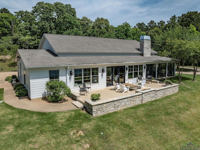 435 Acr 3763, Palestine, TX 75801 - rear view of property with a shingled roof, a patio, a yard, and a chimney