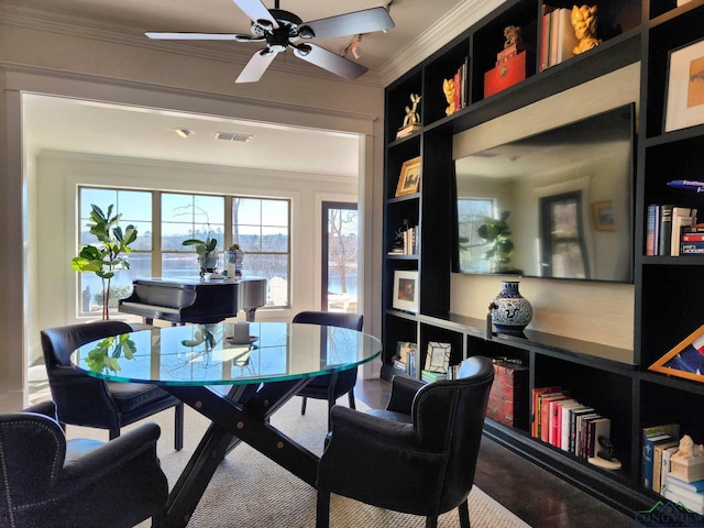 home office featuring built in shelves, ornamental molding, and ceiling fan