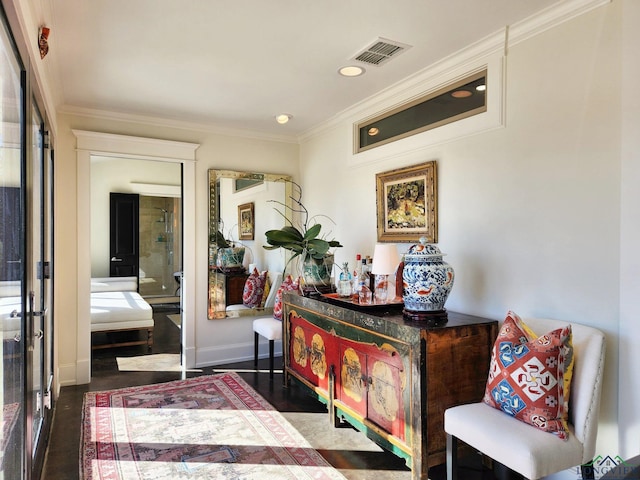 living area featuring ornamental molding and dark hardwood / wood-style floors