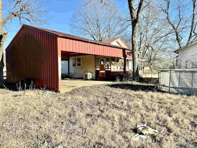 exterior space featuring a swimming pool and covered porch