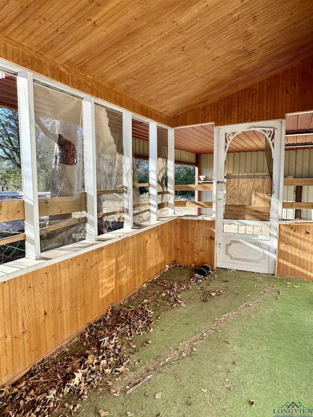 unfurnished sunroom with wooden ceiling and vaulted ceiling