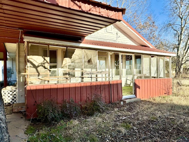 view of home's exterior featuring a sunroom