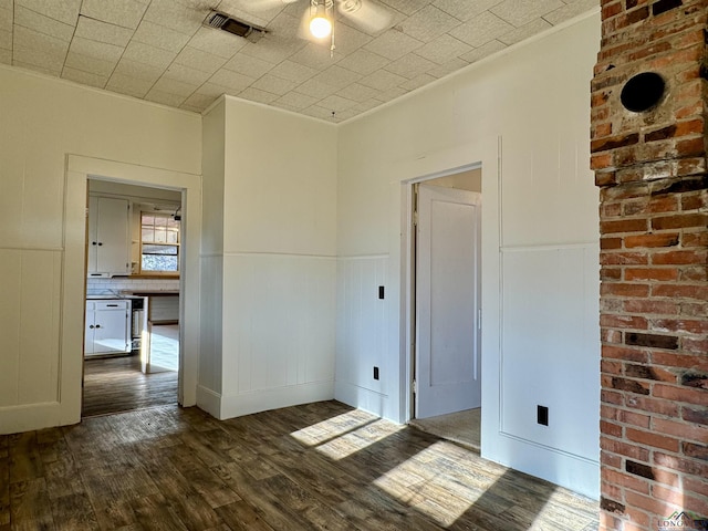 spare room with dark hardwood / wood-style floors