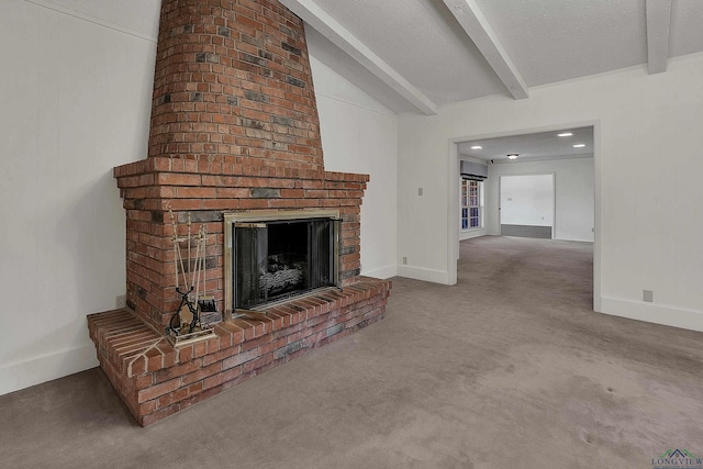 carpeted living room with a textured ceiling, lofted ceiling with beams, and a fireplace