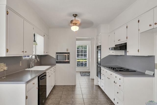 kitchen featuring decorative backsplash, white cabinetry, sink, and stainless steel appliances