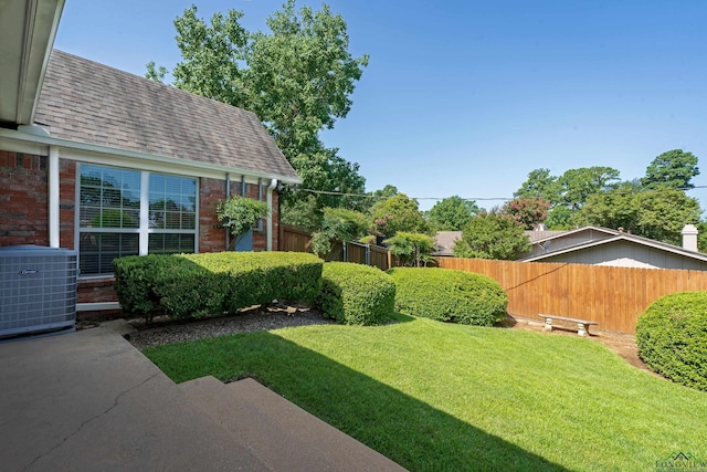 view of yard featuring central AC unit