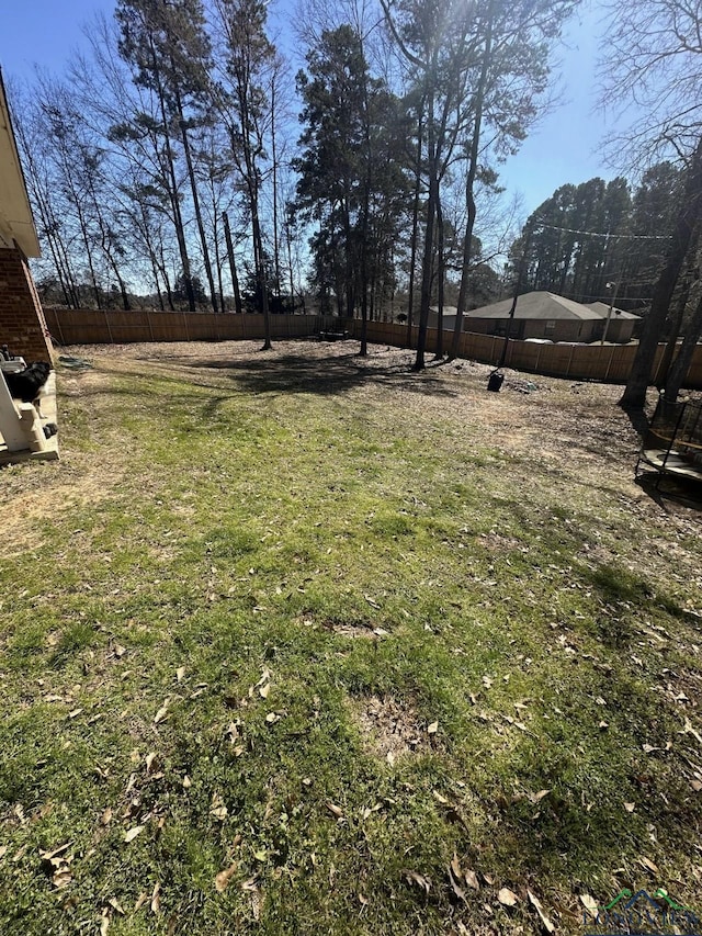 view of yard featuring a fenced backyard